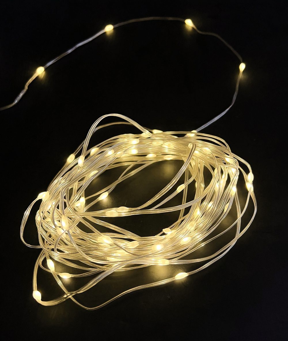 Warm white flexible light strands glowing in the dark
